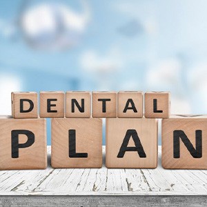 Wooden block letters that spell dental plan