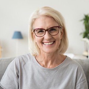 Smiling woman in a gray blouse
