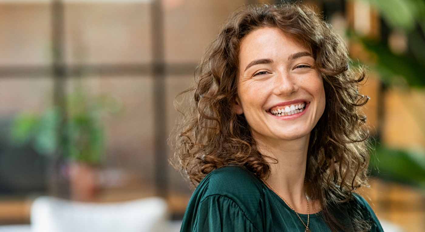 Close-up of woman showing off smile after cosmetic dentistry in Fort Worth