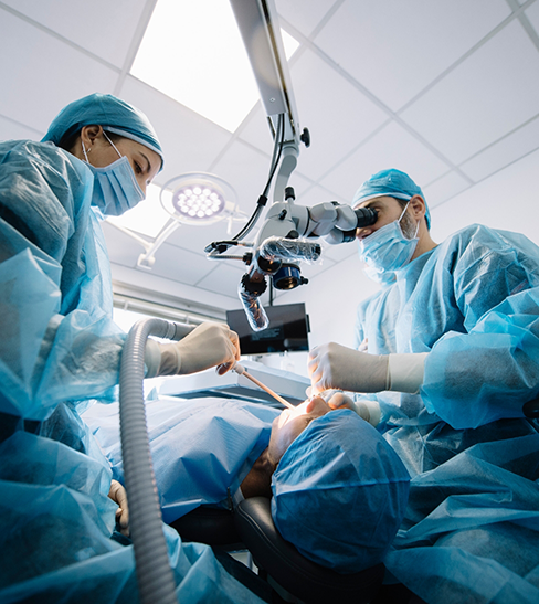 Two dentists performing an antibiotic treatment