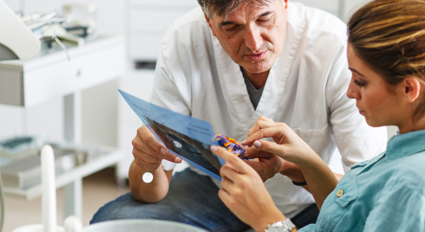 Two dentists looking at an oral appliance